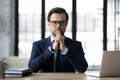 Company executive, CEO, owner in formal suit standing at desk