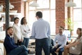 Company executive manager talking with company members during briefing