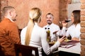 Company of friends eating delicious dinner Royalty Free Stock Photo