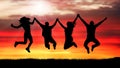 Company of friends, happy people, jumping at sunset silhouette Royalty Free Stock Photo