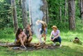 Company friends picnic or barbecue roasting food near bonfire. Hike barbecue. Best friends spend leisure weekend hike Royalty Free Stock Photo