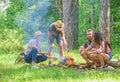 Company friends prepare roasted marshmallows snack nature background. Camping activity. Company youth camping forest Royalty Free Stock Photo