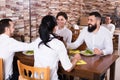 Company of friends in restaurant Royalty Free Stock Photo