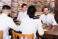 Company of friends in restaurant Royalty Free Stock Photo
