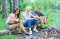 Company friends spend great time picnic or barbecue near bonfire. Idyllic weekend. Friends enjoy weekend barbecue in Royalty Free Stock Photo