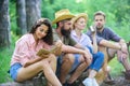 Company friends spend great time picnic or barbecue near bonfire. Idyllic weekend. Group friends spend leisure weekend Royalty Free Stock Photo