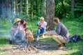 Company having hike picnic nature background. Tourists hikers sit on log relaxing waiting picnic snack. Picnic with Royalty Free Stock Photo