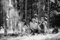 Company hikers relaxing at picnic forest background. Spend great time on weekend. Take a break to have snack. Company