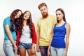 Company of hipster guys, bearded red hair boy and girls students having fun together friends, diverse fashion style Royalty Free Stock Photo