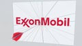 EXXON MOBIL company logo being cracked by archery arrow. Corporate problems conceptual editorial 3D rendering