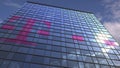 Logo of Deutsche Telekom AG on a media facade with reflecting cloudy sky, editorial animation
