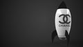 CHANEL logo against a rocket mockup. Editorial conceptual success related 3D rendering