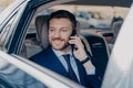 Company manager hearing good news over phone in car Royalty Free Stock Photo