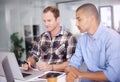 Company, meeting and business men with laptop in creative office for teamwork, review or planning project. Interior Royalty Free Stock Photo