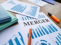 The company merger plan with business charts. Royalty Free Stock Photo