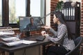 Company office worker in virtual remote video conference with accounting manager