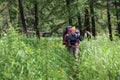 Company of young people are hiking in Altai mountains