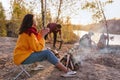 The company of young people are resting in nature