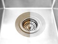 Compare before after cleaning with special detergent of the dirty stainless kitchen sink in a cafe that been using a long time wit