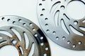 Compare new and old motorcycle brake discs Royalty Free Stock Photo
