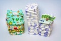 Compare reusable cloth diapers with pile of disposable diapers