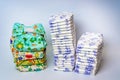 Compare reusable cloth diapers with pile of disposable diapers