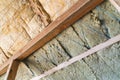 Comparison of mineral and glass wool in one frame. Roof insulation technology. Sheet insulation Royalty Free Stock Photo