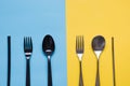 Comparison of metal silverware and plastic cutlery. View from above. Zero waste. Danger of plastic, but virus safe Royalty Free Stock Photo