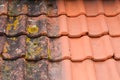 Comparison roof top before and after cleaning moss lichen high pressure water cleaner tile Royalty Free Stock Photo