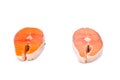 Comparison between wild and farmed salmon blocks on white backgr Royalty Free Stock Photo