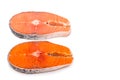 Comparison between wild and farmed salmon blocks on white backgr