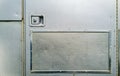 Compartment door on the side of a silver metallic horse trailer Royalty Free Stock Photo