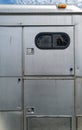 Compartment doors on the side of a silver metallic horse trailer Royalty Free Stock Photo