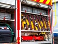 Compartment of rolled up fire hoses on a fire engine. Rescue fire truck equipment