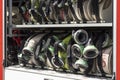 Compartment of rolled up fire hoses on a fire truck.