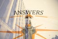 Composite image of compass with answers text