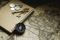 Compass, antique keys and notebook on blur vintage world map, journey concept, copy space Royalty Free Stock Photo