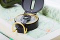 Compass and binoculars on map closeup Royalty Free Stock Photo