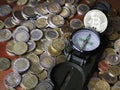 Compass and Bitcoin on a pile of Euro coins