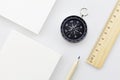 Compass with blank white business paper , ruler, pencil on white b