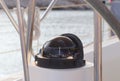 Compass in the cockpit of a sailing yacht cruise. Wind rose and determine the direction of motion relative to the magnetic poles Royalty Free Stock Photo