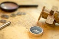 Compass ,coins and Wooden plane on world map, selective focus , vintage  style.Travel and holiday Royalty Free Stock Photo