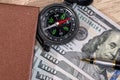 Compass on dollar bills. close up. Royalty Free Stock Photo