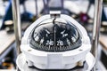 A compass, a front view from on a sailing yacht. Royalty Free Stock Photo