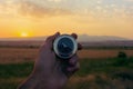 Compass in hand on a background of nature Royalty Free Stock Photo