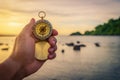 Compass in the hand on the nature. Royalty Free Stock Photo