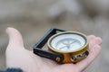 Compass in hand. Student make choice in his future, life direction to success. Royalty Free Stock Photo