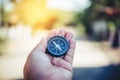 Compass in the hand ,Tourists hold a compass and locate a place