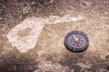 Compass is lying on the ice surface in a winter frosty day. Toned image