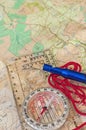 Compass on Map and Rescue Whistle Royalty Free Stock Photo